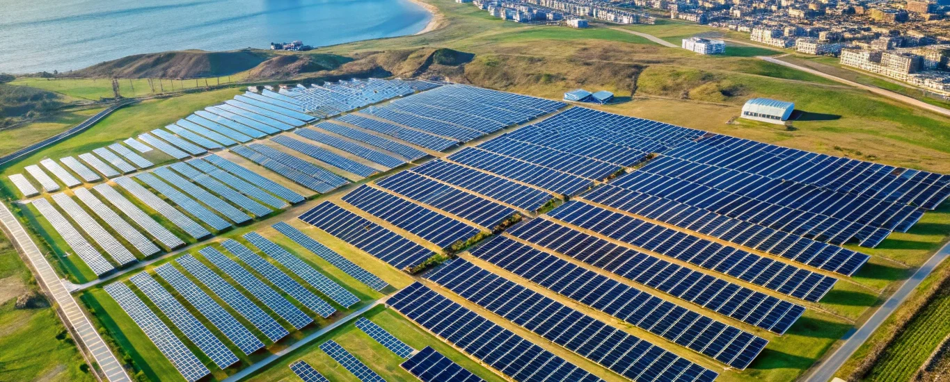 Aerial view of a solar farm near Baku coastline highlighting renewable energy investment.